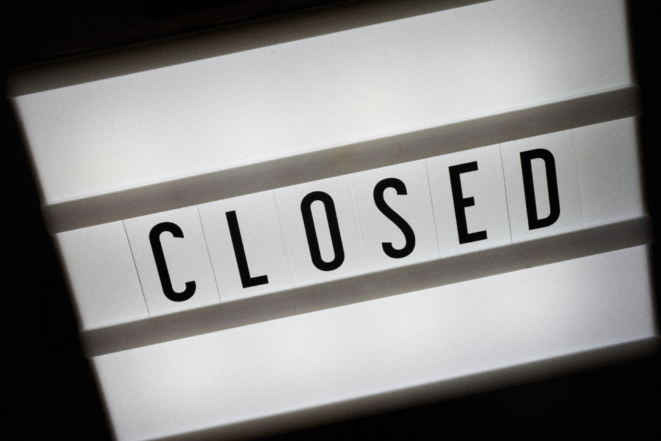 A lightbox sign spelling out the word closed